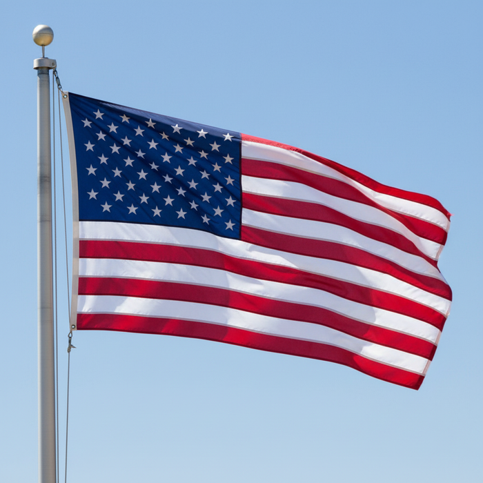 American Flag Hanging from Metal Pole Outdoors